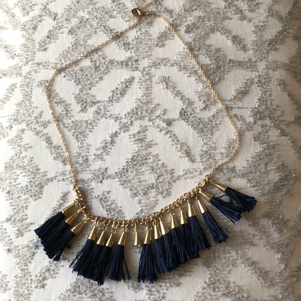 Gold necklace with navy blue tásales